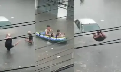 Jóvenes se echan clavados en calles inundadas en Veracruz