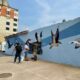 Jóvenes grafiteros restauran mural vandalizado del malecón de Coatzacoalcos