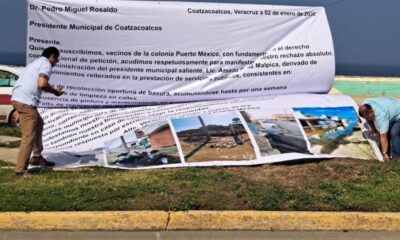 Con lona en el Malecón, vecinos de Puerto México exigen rescate tras abandono heredado
